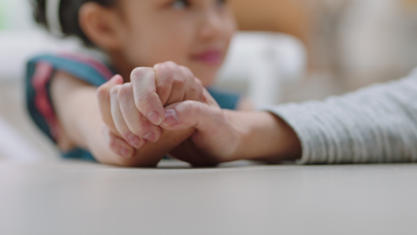 Close up little girl holding grandmothers hand showing affection loving child showing compassion for granny enjoying bonding with granddaughter family concept 4k footage | Shutterstock HD Video #1034219063