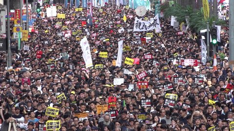 HONG KONG – 1 JULY 2019: Protesters occupy streets of central Hong Kong during massive demonstration against extradition bill and China's encroachment in the city

