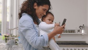 happy mother and baby having video chat using smartphone mom holding toddler enjoying mobile technology sharing motherhood lifestyle with friend on social media