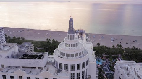 Aerial over Art Deco Hotel monument in the Art Deco District of Miami beach. In the background is Miami Beach. Florida, USA. 10 July 2019 