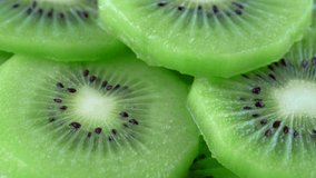 macro rotation video shooting of slice kiwi fruit .Close up flesh of kiwi.
