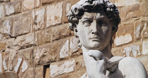 Close-up glorious famous replica statue of Michelangelo' David in center of Piazza della Signoria. Walking around Florence, Italy.