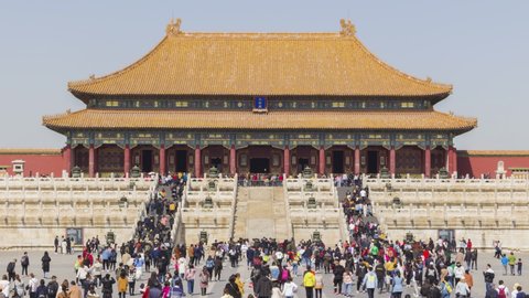 BEIJING, CHINA - MARCH 15, 2019: Hall of Supreme Harmony in Forbidden City at Clear Day and Crowd of Tourists. Medium Shot. Time Lapse