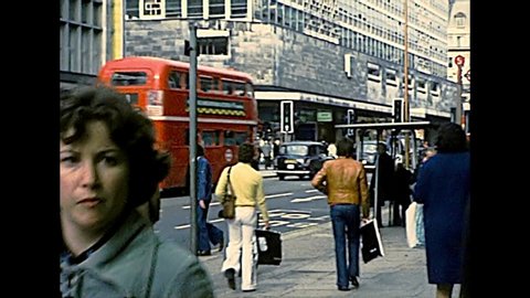 LONDON, UNITED KINGDOM - CIRCA 1977: people in Soho shopping area of Westminster city, between Oxford Street and Regent Street. Archival of London in 1970s.