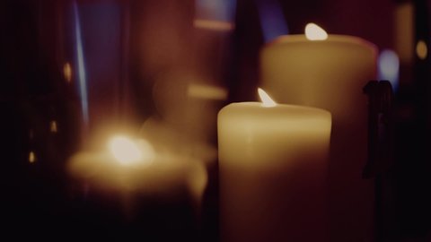 Beautiful candel in the dark room.
