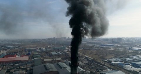 Smokestack emissions black smoke coming from chimney of coal-fired plant
