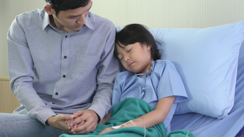 Asian father rub the body patient girl for reduce the temperature and physical examination at hospital. Chinese Covid-19 coronavirus symptoms. People may be infected by deadly coronavirus examined. Royalty-Free Stock Footage #1034297120