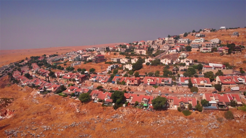 Small Village with red rooftops in the desert Heat Aerial
Drone footage over small Village in zefat Israel 
