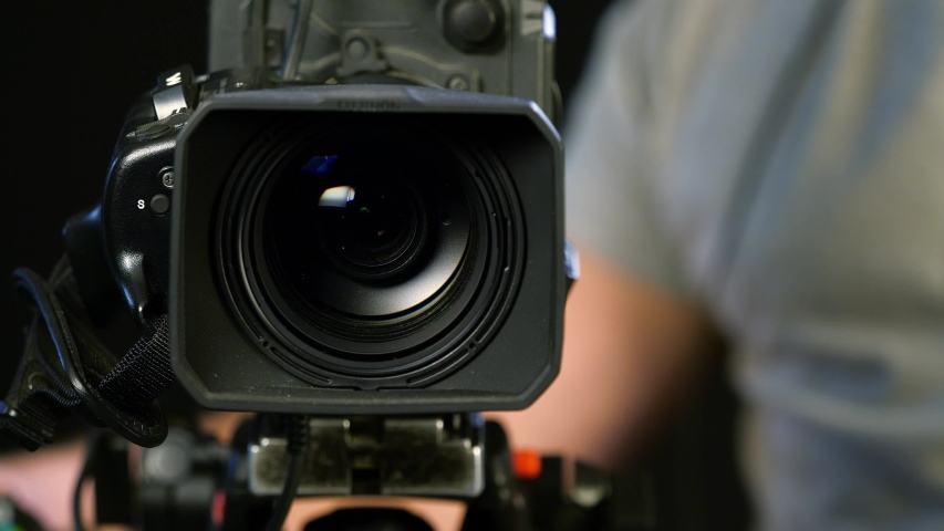 Cameraman behind camera in studio 3 | Shutterstock HD Video #1034307314
