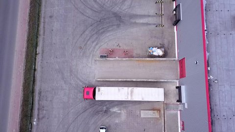 Truck is Driving to Logistics Center. Aerial Shot. Camera is Flying. Aerial Drone