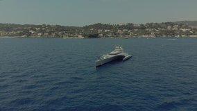 Beautiful yacht in the blue sea off the coast of France Monaco city town Monte Carlo Drone flight port yahts sea flats