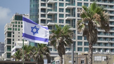 Flag of Israel hung in honor of the Independence Day of Israel. New construction in Israel. Buildings in Israel. Tel Aviv