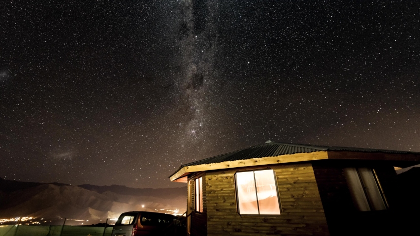 Timelapse - Milky Way rotates over cabin.