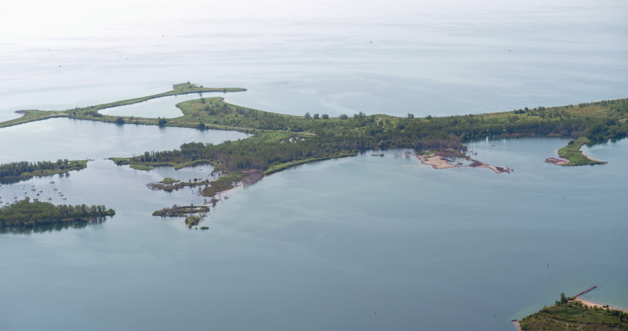 Wide aerial tracking shot of Toronto Island and Lake Ontario.