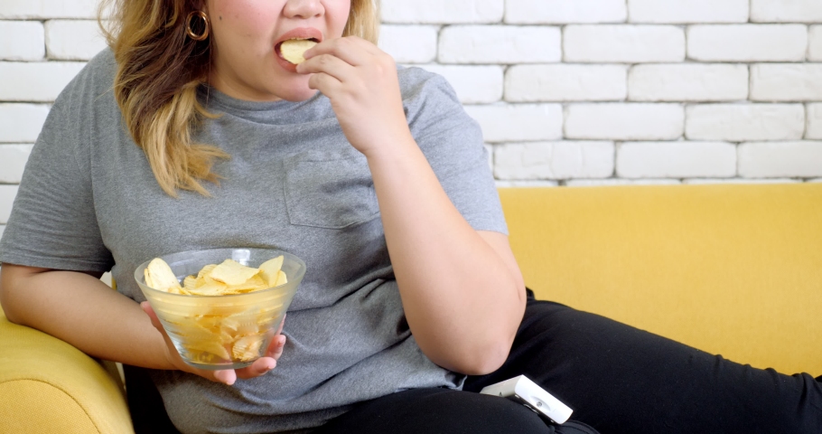 Fat Woman Eating Potato Chips Stock Footage Video (100% Royalty-free)  1034360000 | Shutterstock