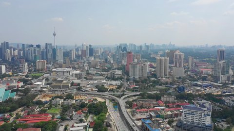 kuala lumpur cityscape traffic road downtown sunny day aerial panorama 4k malaysia