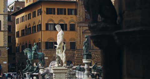 Florence, Italy - 19 June, 2019: Fontana del Nettuno, Piazza della Singoria. Stunning cityscape of italian ancient town. View of wonderful square in old unesco heritage city of Florence.