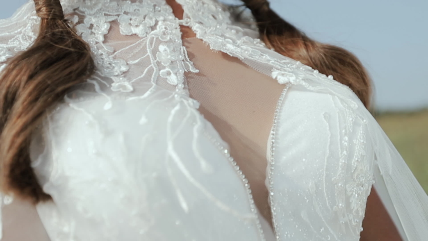 View Of Attractive Bride In White Wedding Dress And Black Floppy Hat. Fashion Model Posing In Nature. Bust Of Stylish Woman, Elegant Dress, Feminine Concept.