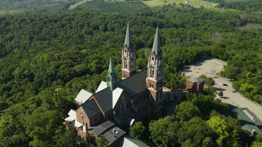 Holy Hill National Shrine of Mary, Wisconsin, USA, aerial view with right to left fligt and tracking of Basilica drone footage.