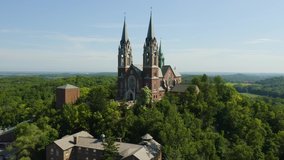 Holy Hill National Shrine of Mary, Wisconsin, USA, aerial rigt to left track to elevated view drone footage.