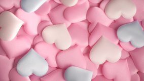Valentine's Day Background. Holiday Abstract Valentine Background with colorful pastel satin Hearts. 4K UHD Video Footage. Rotated Heart Shape Backdrop. Love concept