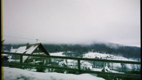 Vintage VHS old 16mm film tape with dust and noise view from the car - Seebach Germany Baden-Wurttemberg village covered with snow - Powered by Shutterstock - Get 15% off with code: PIKWIZARD15