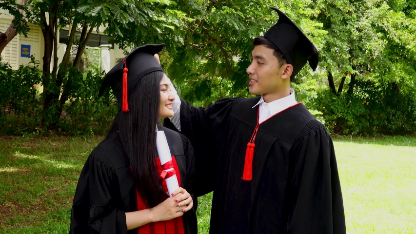 man woman couple dressed black graduation Stock Footage Video (100%  Royalty-free) 1034415407 | Shutterstock