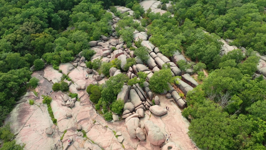 Elephant Rocks with people enjoying it on sunny day. Missouri USA. Aerial circle pan