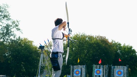Male archer is using the bow to aim. Archery shooting. Stock Video
