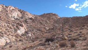 HD resolution clear sunny summer morning video footage of bright red granite boulders rocky landscape, plains area around it near town Aus and Keetmanshoop - Luderitz B2 highway, southern Namibia, Afr