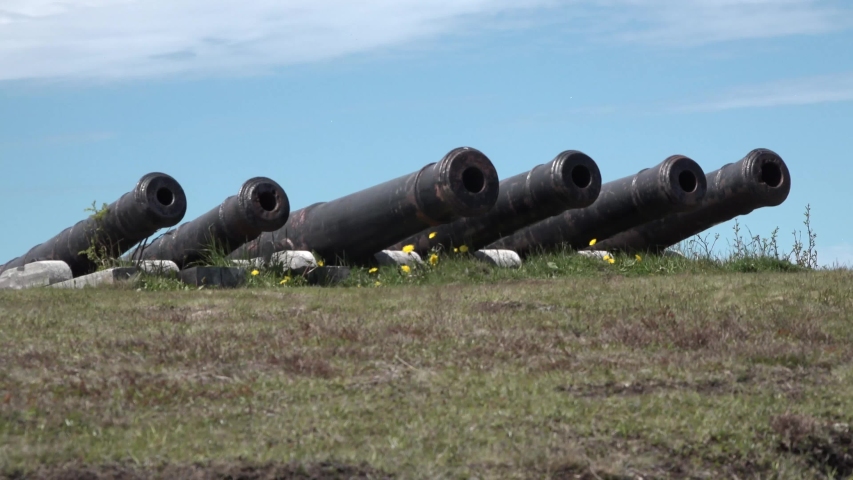 Old cannons guard the harbor entrance.