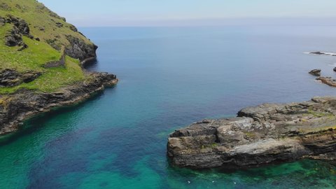 Drone footage of Tintagel coastline looking out over the SW coast path in Cornwall.