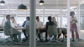 group of business people meeting in boardroom team leader woman presenting ideas on whiteboard discussing strategy with colleagues in office training presentation 4k - Powered by Shutterstock - Get 15% off with code: PIKWIZARD15