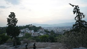 Athens day to night timelapse of sunset cityscape from Acropolis view point
