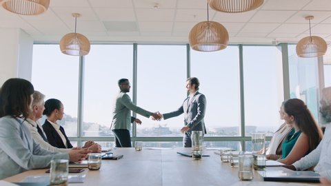 business people handshake in boardroom meeting successful corporate partnership deal executives shaking hands colleagues clapping hands welcoming opportunity for cooperation in office 4k