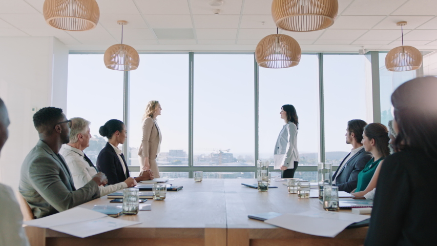 business women shaking hands in boardroom meeting successful corporate partnership deal with handshake colleagues clapping hands welcoming opportunity for cooperation in office 4k Royalty-Free Stock Footage #1034473064