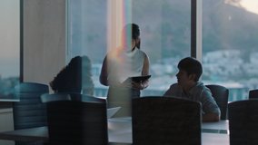 business people working late asian team leader woman meeting with colleagues discussing project manager sharing ideas on tablet computer group of executives brainstorming in office at sunset - Powered by Shutterstock - Get 15% off with code: PIKWIZARD15