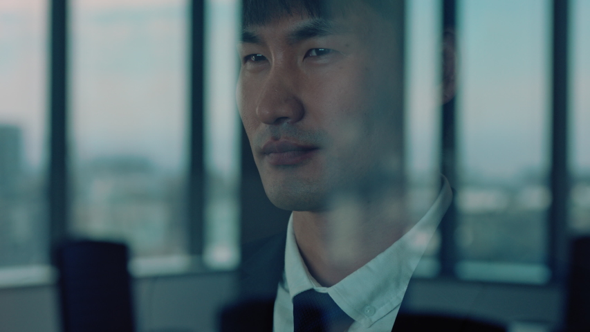 successful asian businessman looking out window proud ceo planning ahead thinking of ideas for future investment strategy corporate manager enjoying leadership career in office Royalty-Free Stock Footage #1034474762