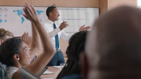businessman presenting successful solution to shareholders celebrating with applause congratulating executive for growth in sales clapping hands in office boardroom meeting