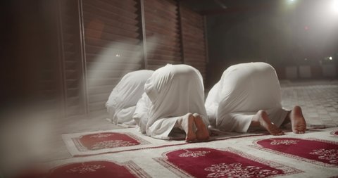 Ramadan. Religious Muslims pray in prayer room. 4K Slow Motion