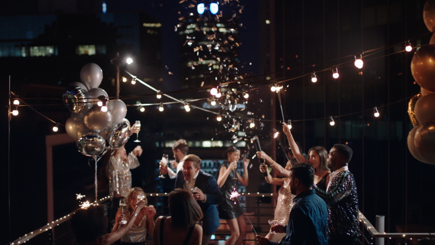 Friends Celebrating New Years Eve Party Stock Footage Video (100% Royalty-free) 1034503823
