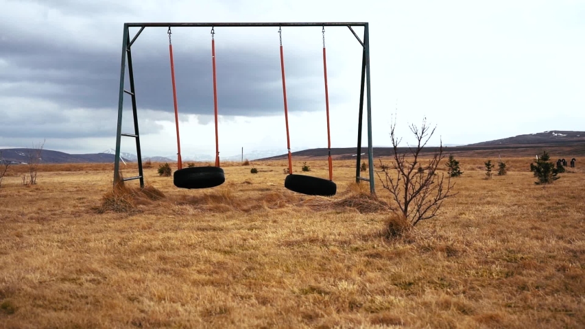 Old age swings dramatically shown with 360 roll. Moody vibes and cloudy skies. Shot in 4k with the Sony a7iii and Ronin S.