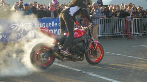 valence / France - 03 23 2019: World famous Female Biker Doing A Burn On Her suzuki gsxr Bike At A French Stunt Event