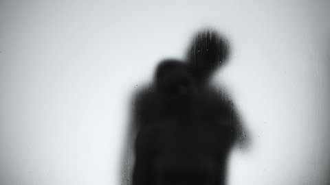 Silhouette of lovers couple hugging and kissing in shower, intimate relationship