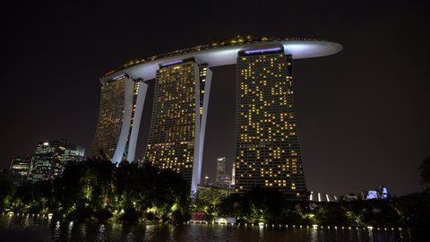 SINGAPORE CITY, SINGAPORE - MARCH 28, 2019: Marina Bay Sands is an integrated resort fronting Marina Bay at night view, establishing shot