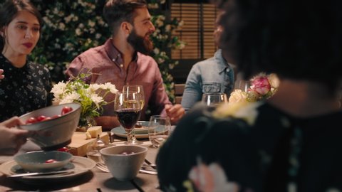 group of friends celebrating making toast to friendship at evening dinner party celebration drinking wine sharing homemade meal enjoying weekend reunion relaxing on calm summer night outdoors 4k Vídeo Stock