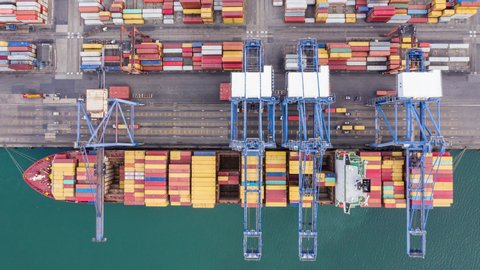Time-lapse international cargo  container shipping port by the sea business aerial top view footage in Thailand