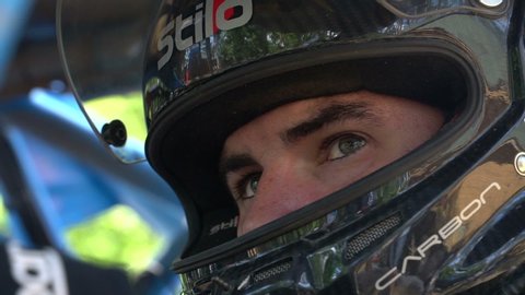 Ukraine, Sumy 17.06.2019: Race Driver Waiting for Race close up. Man on Race Helmet. Professional driver on Race Helmet.
