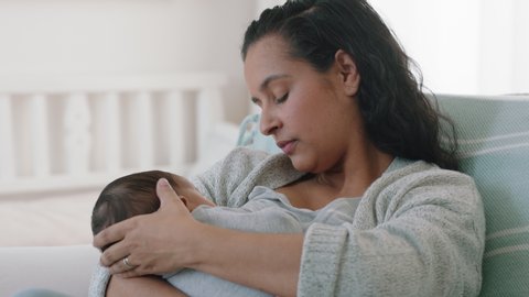 mother breastfeeding baby at home mom nursing infant nurturing child suckling milk from breast motherhood maternity care