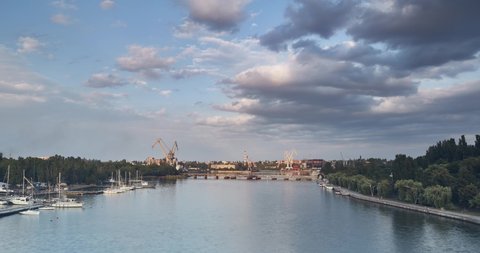 timelapse panorama of the evening city. Mykolaiv, Ukraine. Nikolaev. beautiful sky and ferries are running. summer evening. time lapse ultra high definition 4k